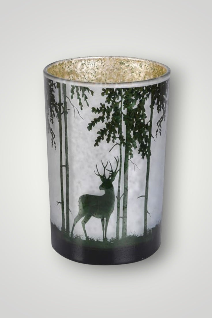 Decorative candle holder with deer and forest design on a white background