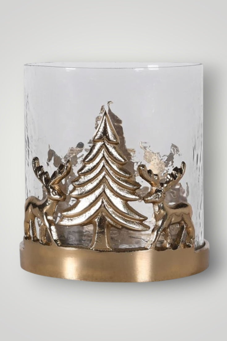 Decorative candle holder with gold Christmas tree and reindeer design on a white background