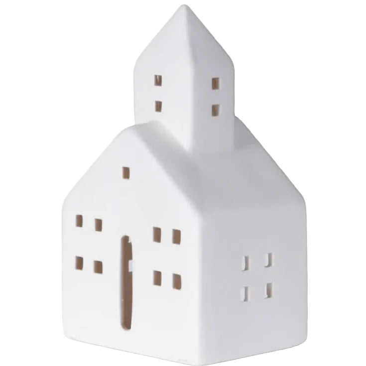 White house-shaped decorative item on a light gray background