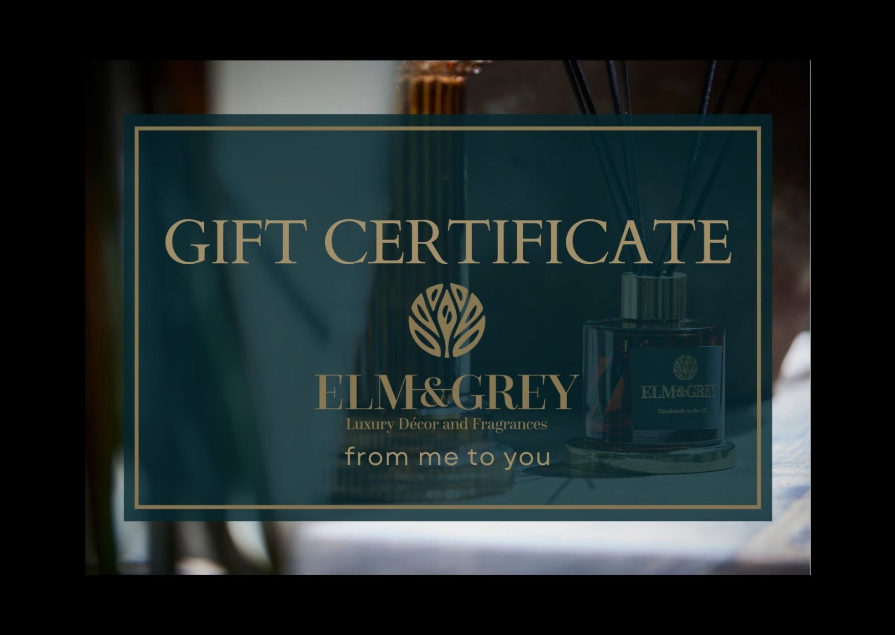 Gift certificate for Elm & Grey luxury decor and fragrances with a blurred background