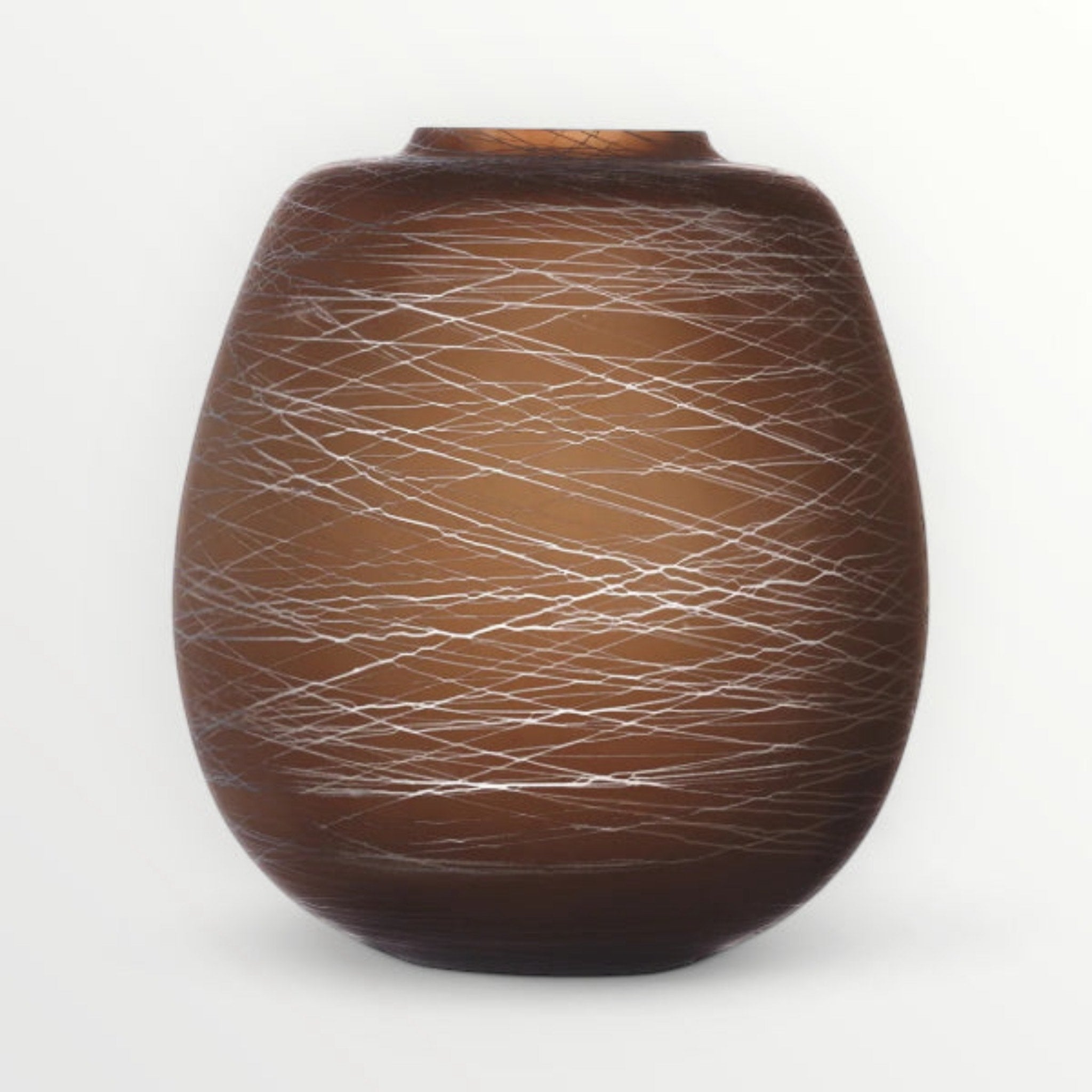 Brown vase with intricate white patterns on a white background