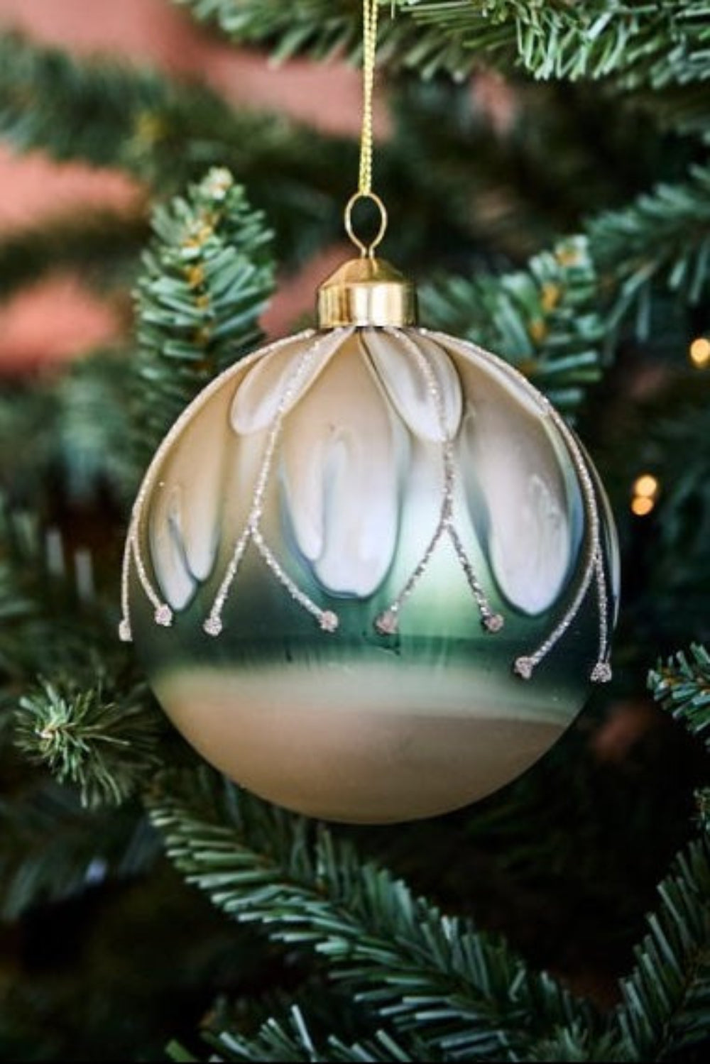 sage and white bauble on a tree