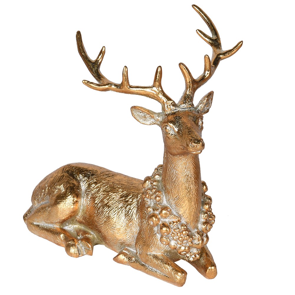 Gold deer figurine with intricate details on a white background