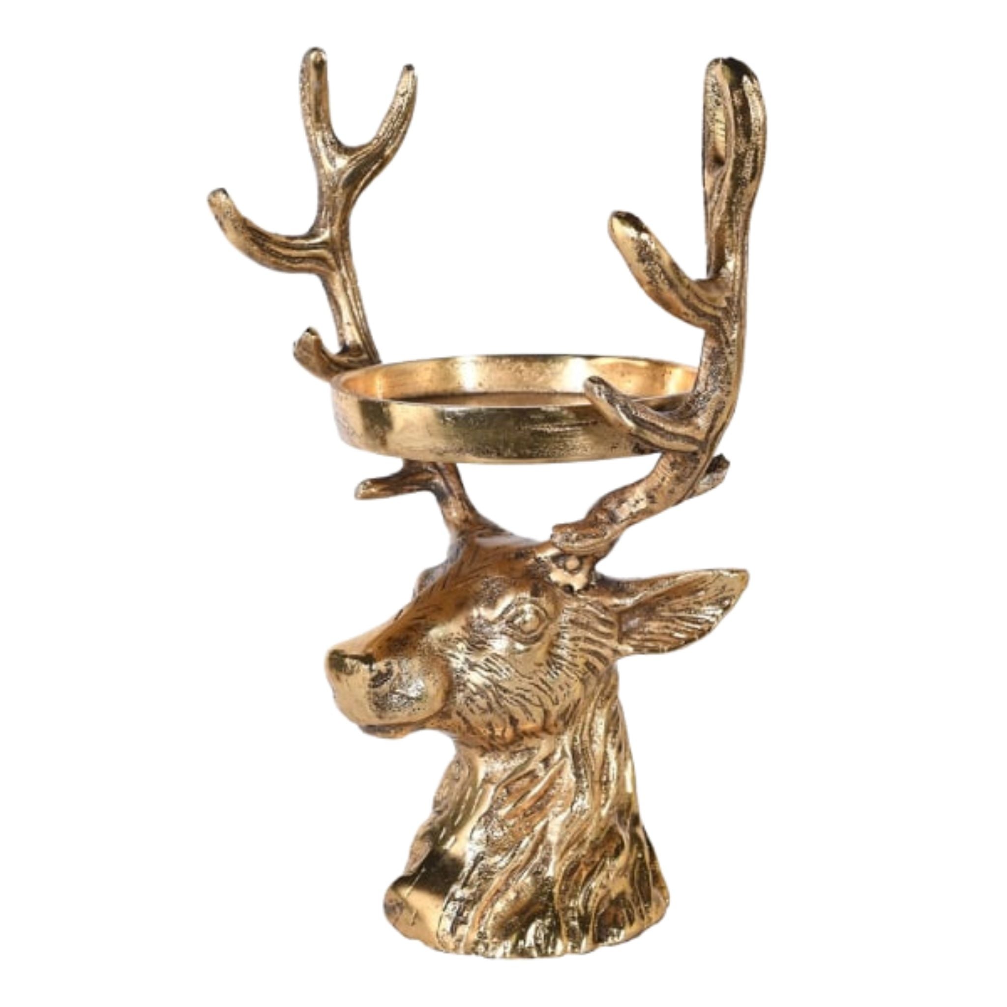 An antique gold stag head candle holder designed for a pillar candle