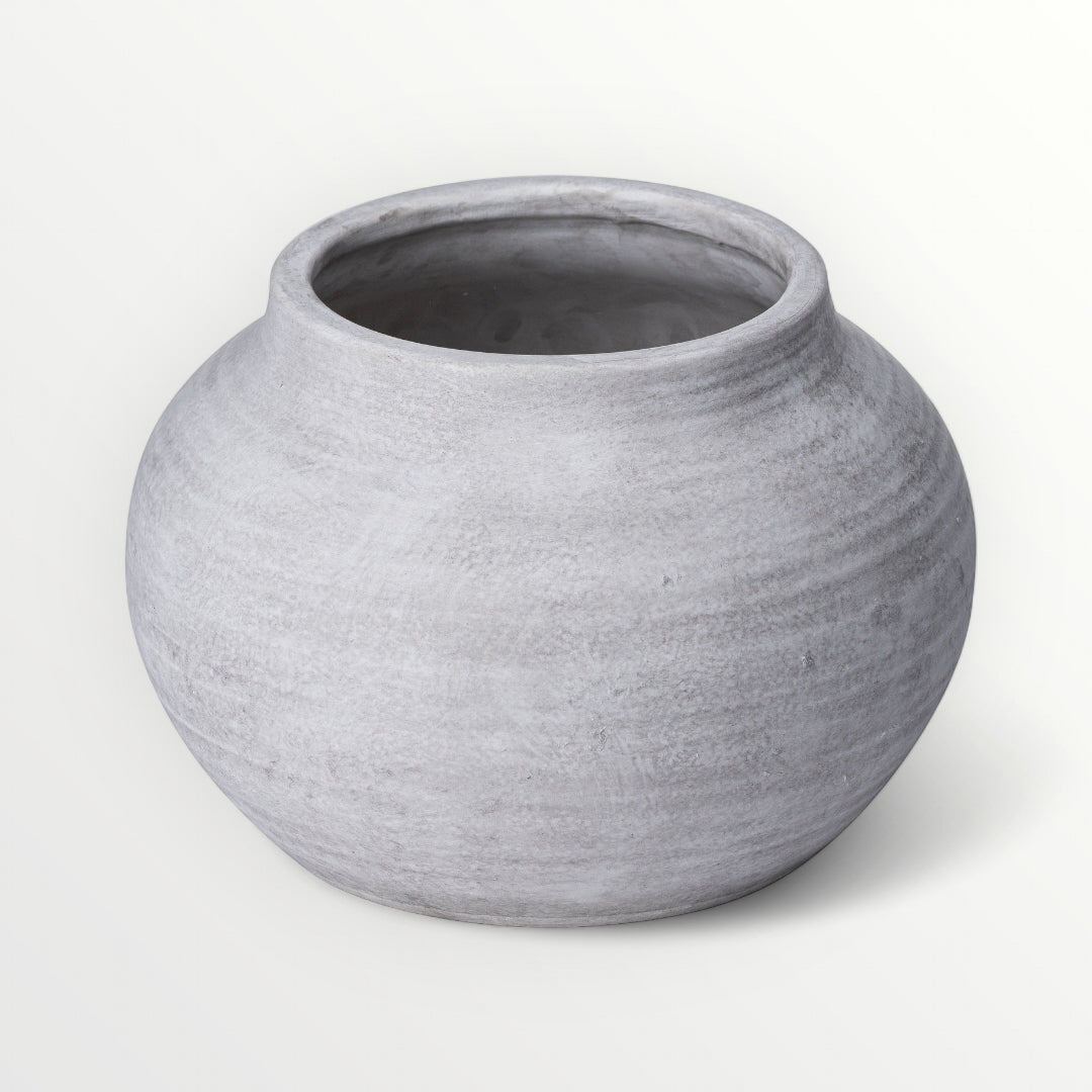 Grey-white ceramic planter on a white background