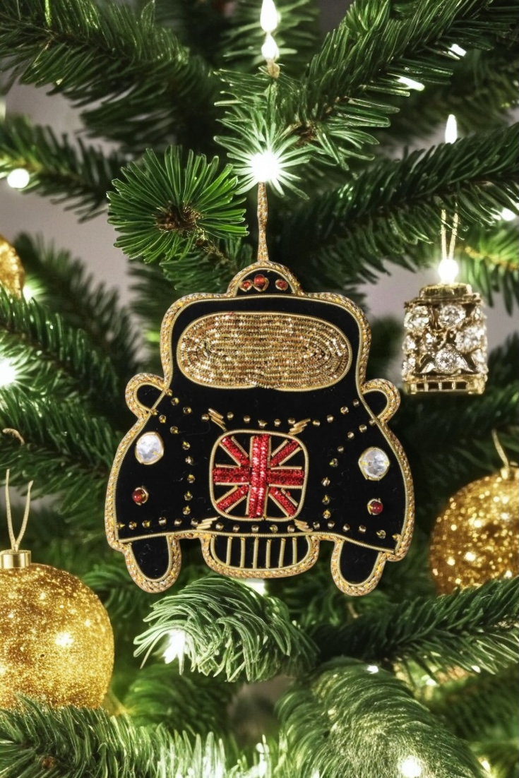 Decorative ornament shaped like a black car with a British flag on a Christmas tree.