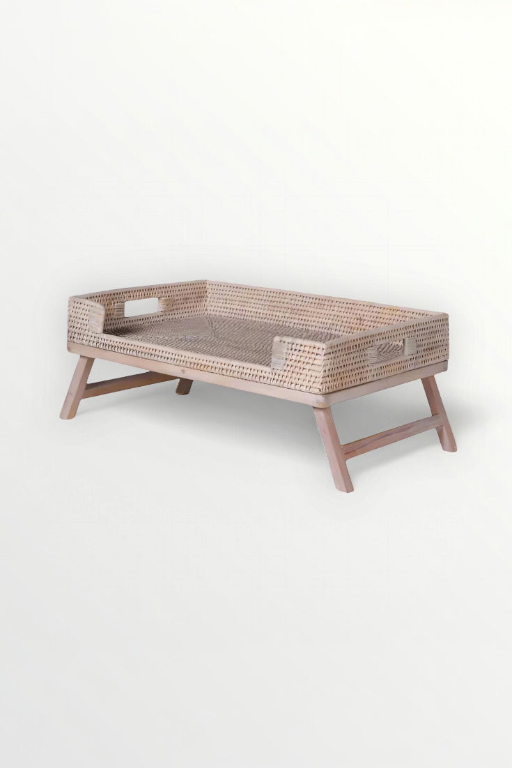 Limewashed woven breakfast tray with wooden legs on a white background, Elm & Grey.