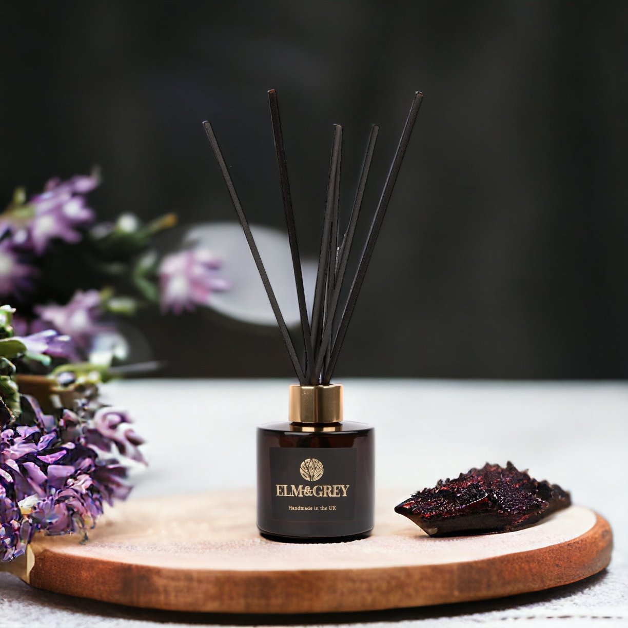 Amber Diffuser surrounded by Lavender and Tonka