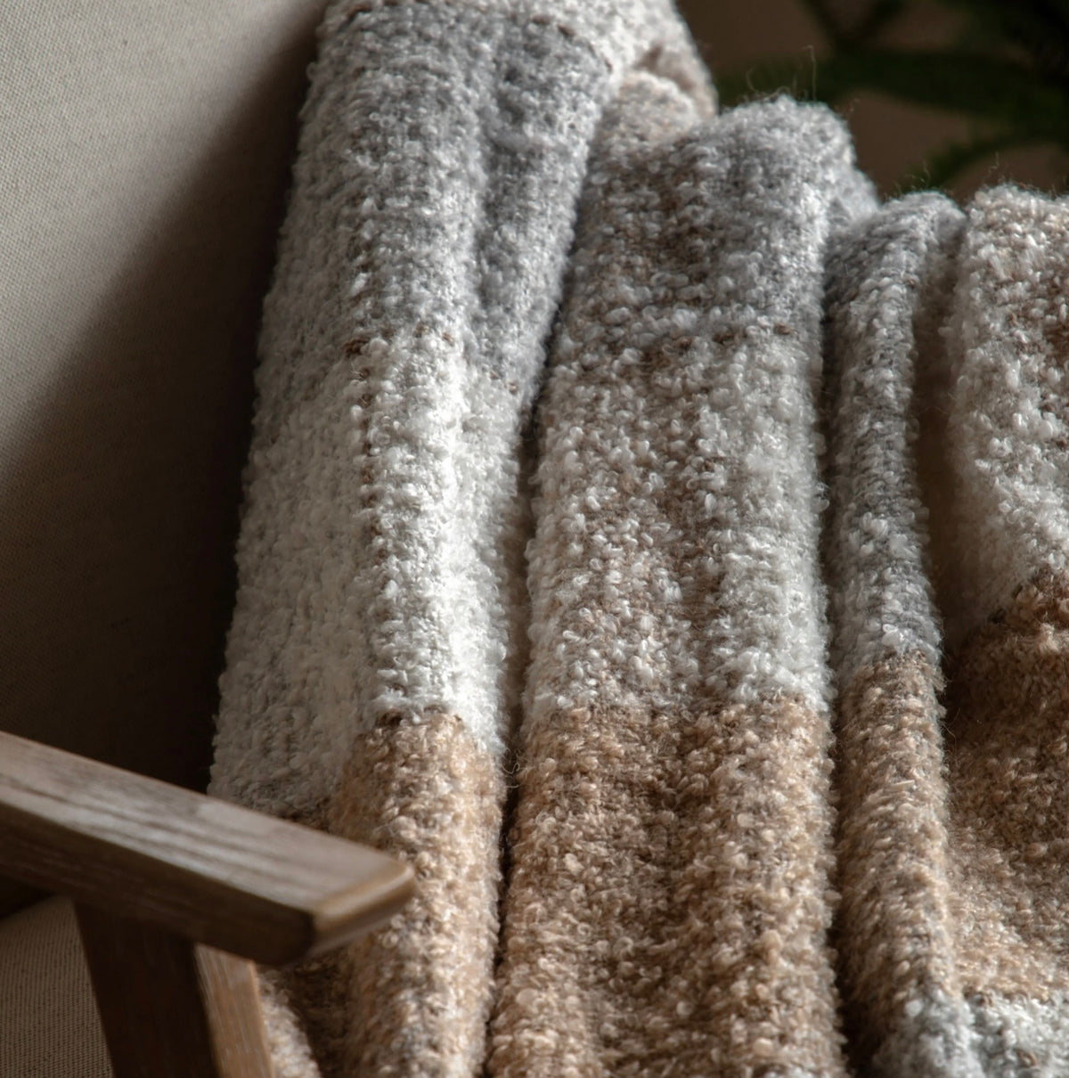 Close-up of textured carpet samples in neutral colors.