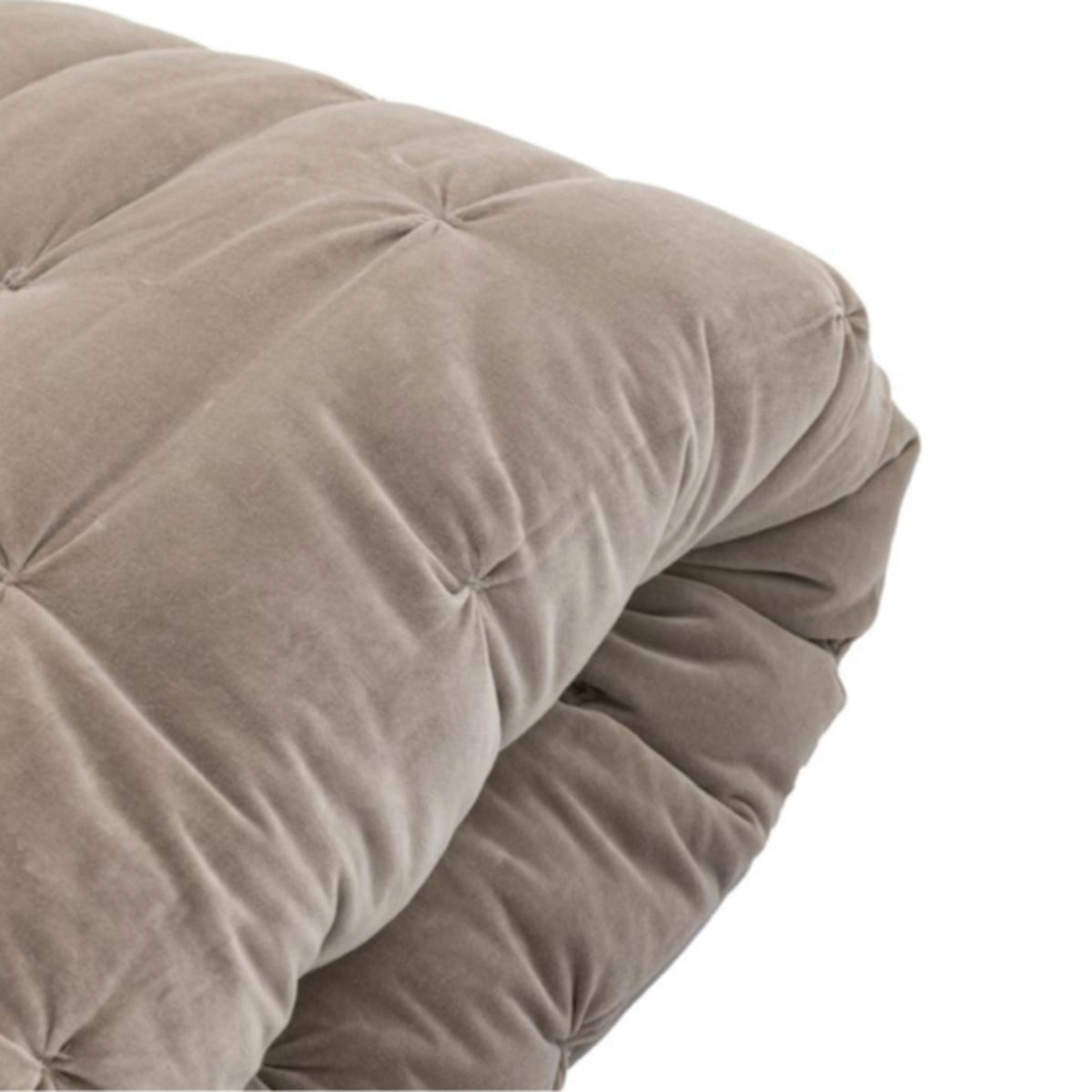 Close-up of a brown quilted comforter on a white background