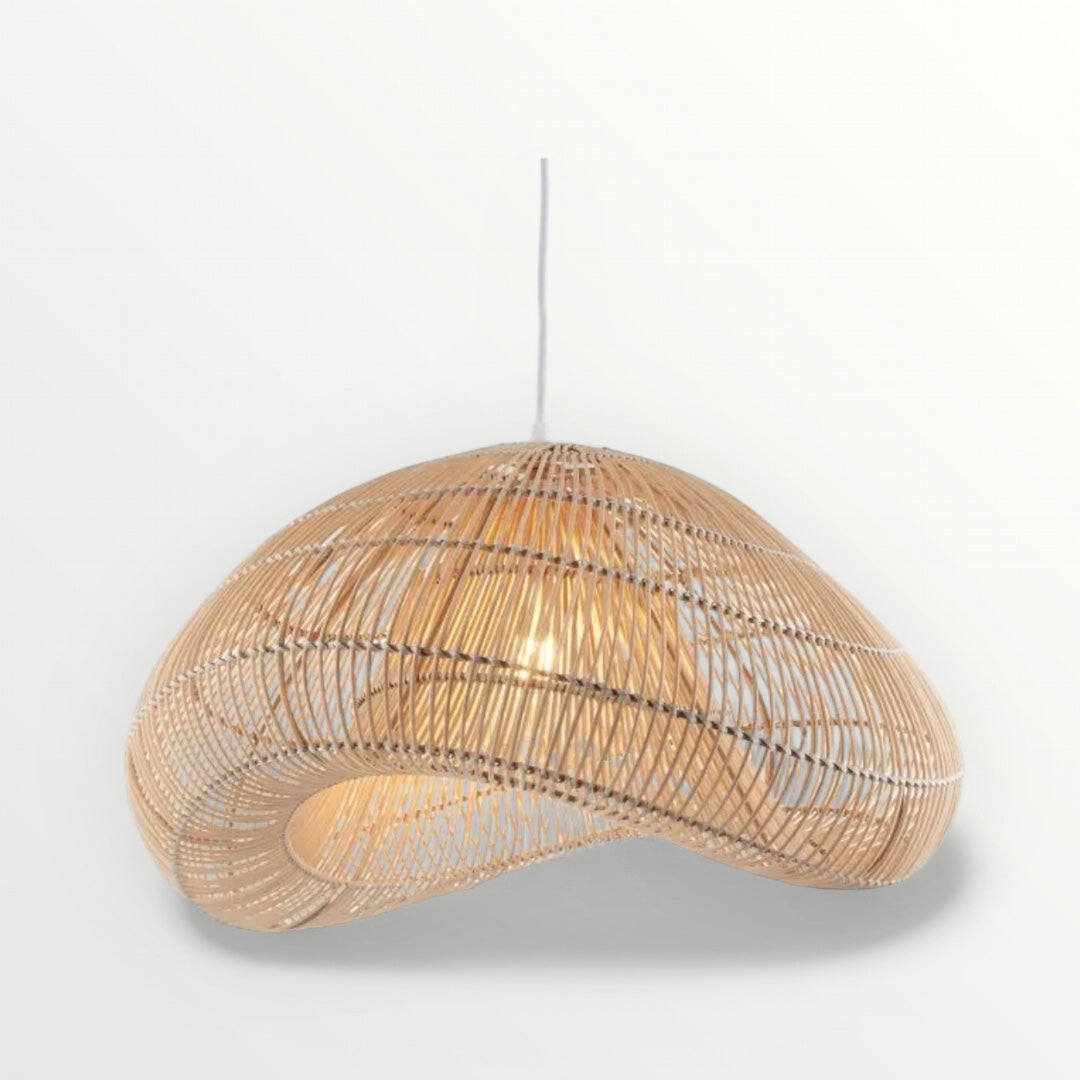 A beige rattan pendant lamp shade with a cloud-inspired shape, designed for hanging in ceilings. Elm & Grey.