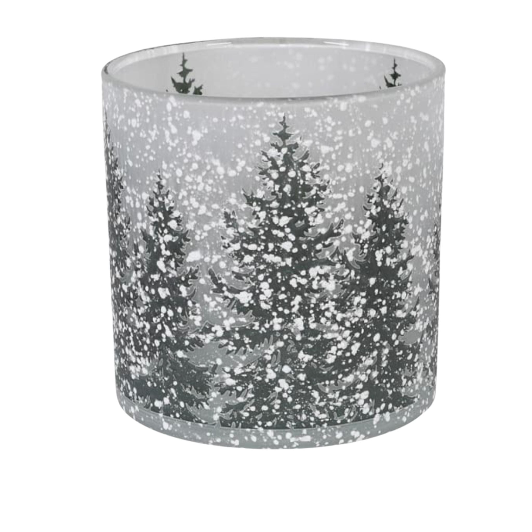 A frosted glass candle holder with snowy tree motif