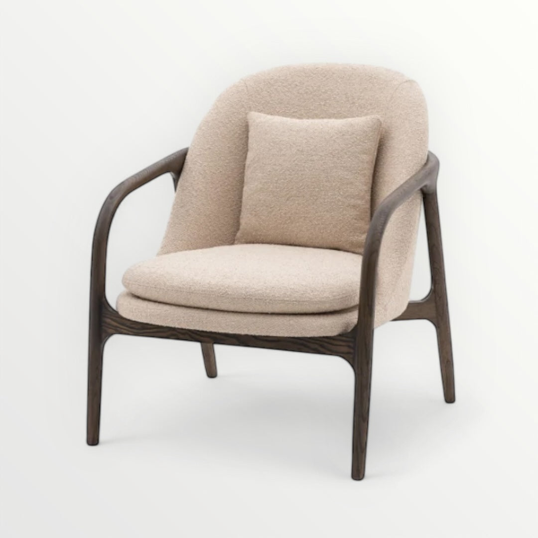 Taupe armchair with wooden frame on a white background, Elm & Grey.