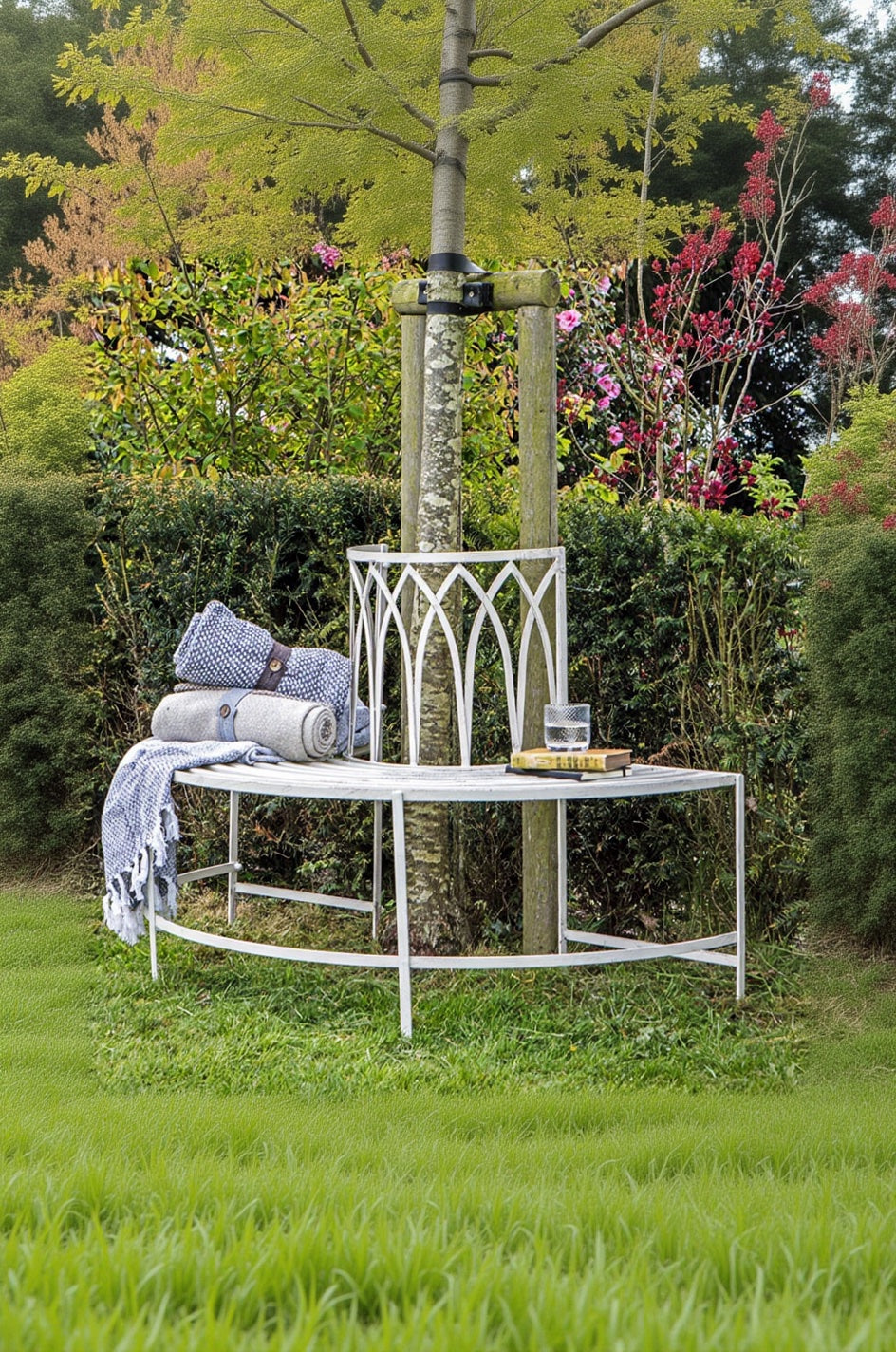 white distressed tree bench in a garden