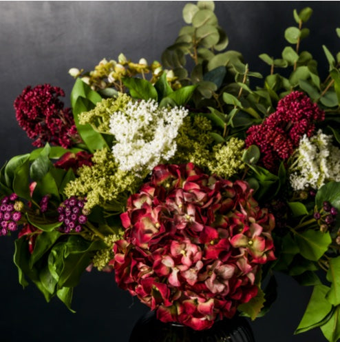 deep red faux hydrangeas and skimmia