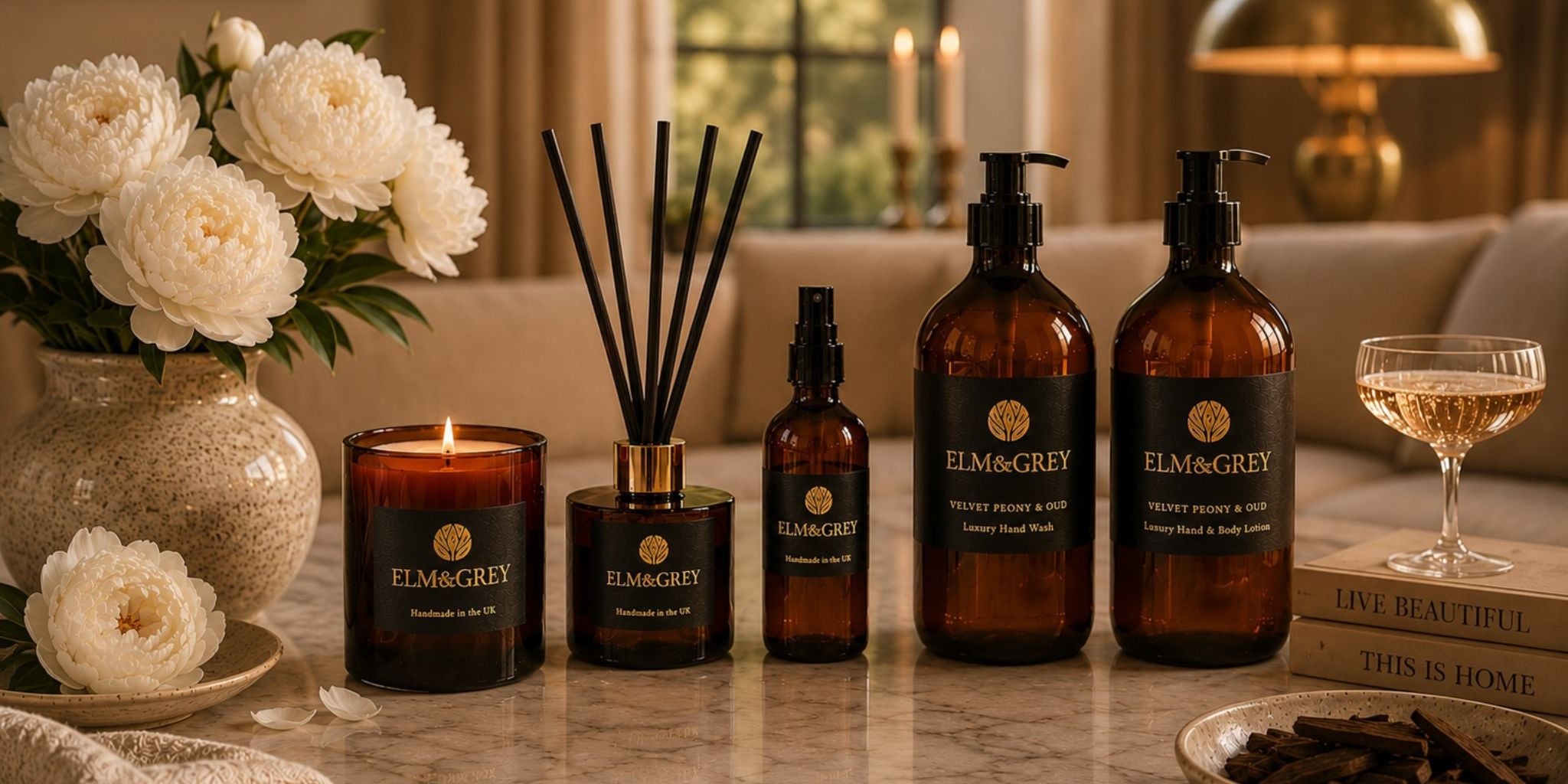 lit elm and grey amber candle on a table