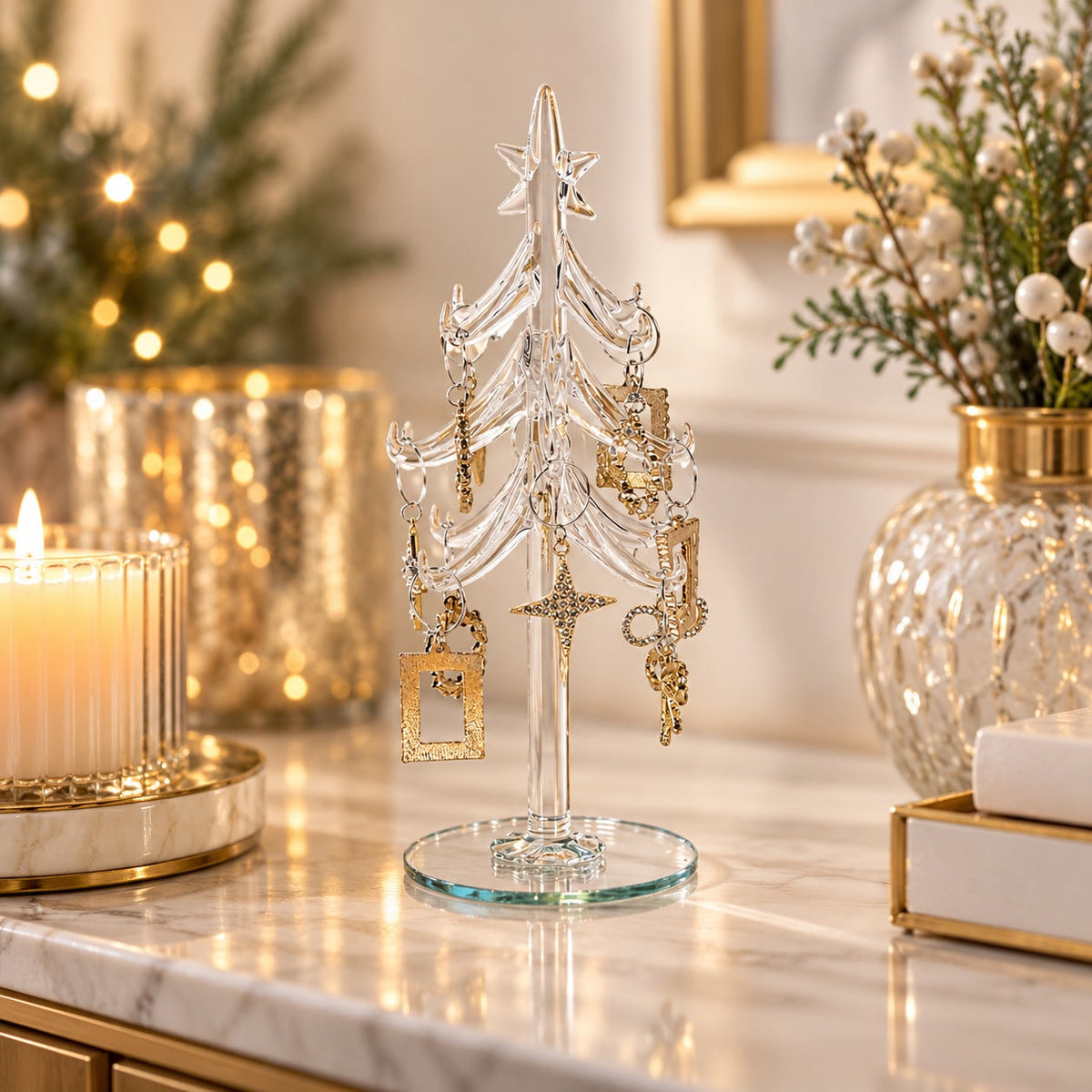 Glass Christmas tree styled with candlelight and festive greenery