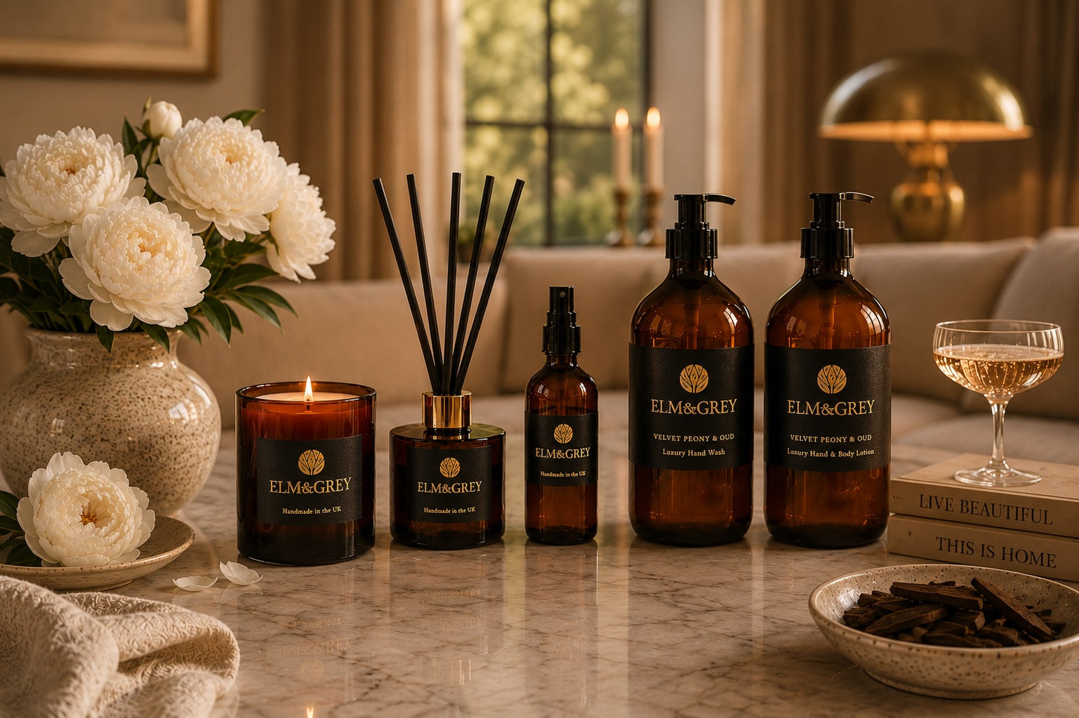 Velvet peony and oud fragrance collection by elm and grey including scented candle, reed diffuser, room spray, hand wash and lotion.