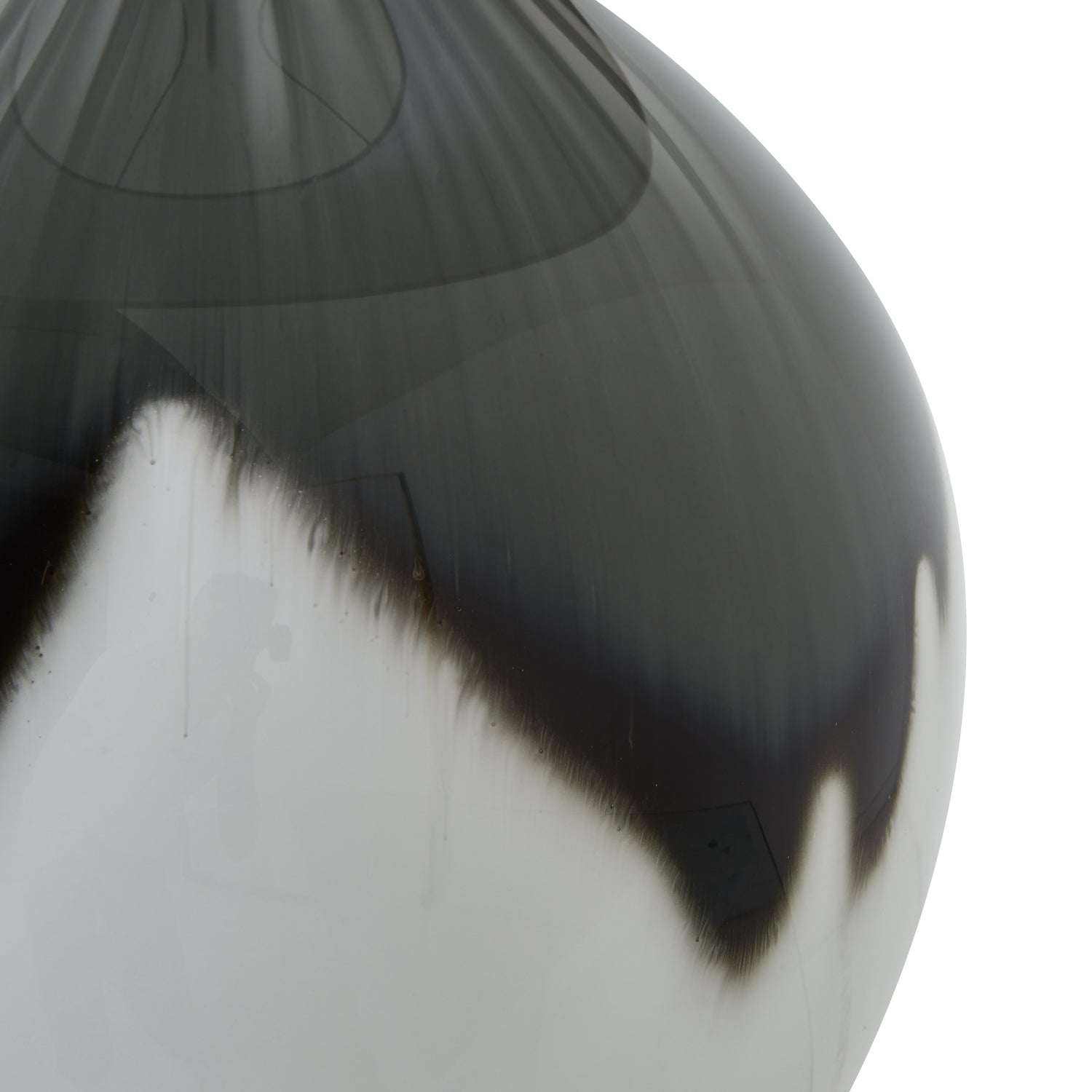 Close-up of a grey, black and white ceramic vase on a white background
