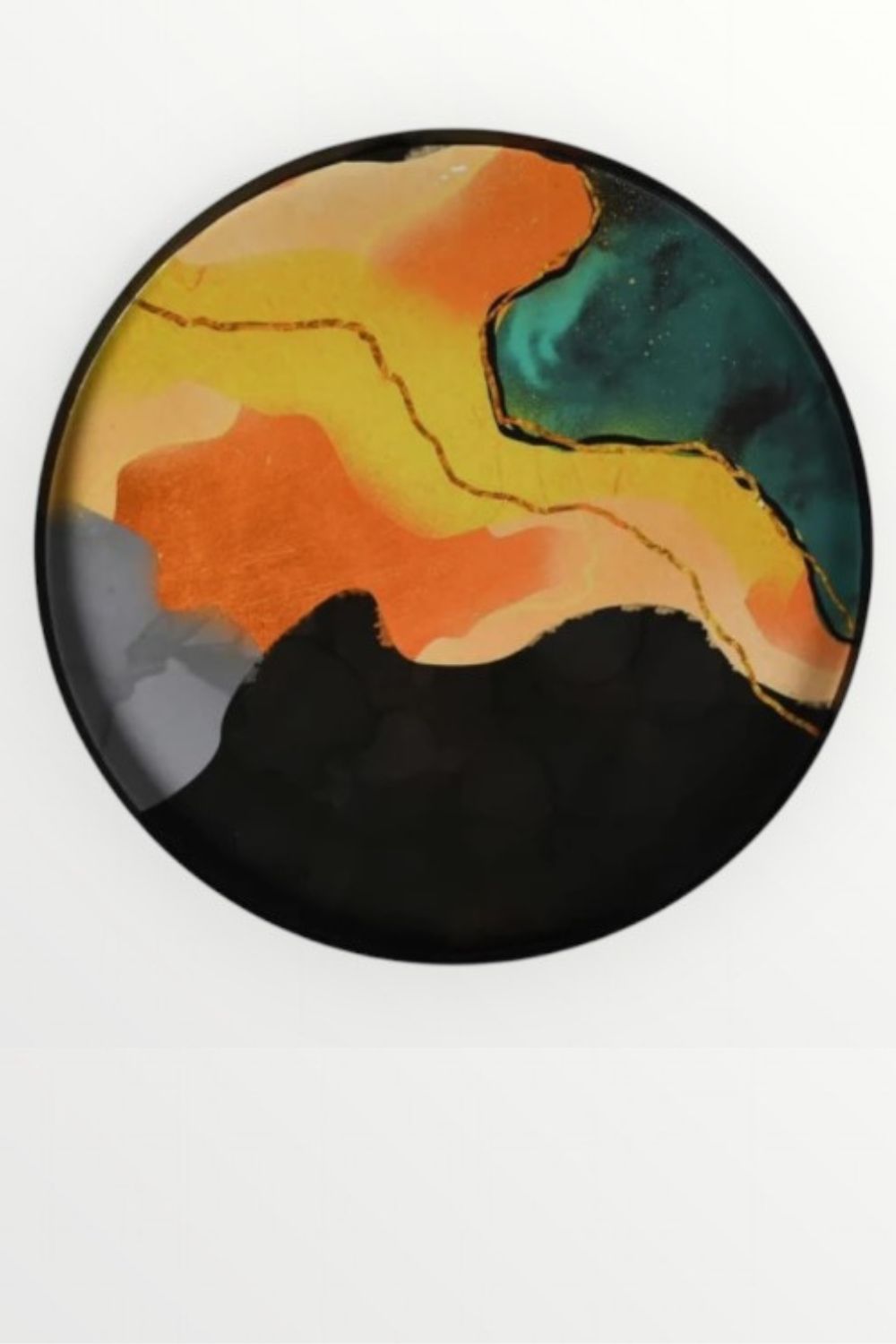 Round metal tray with abstract multicolored design on a white background