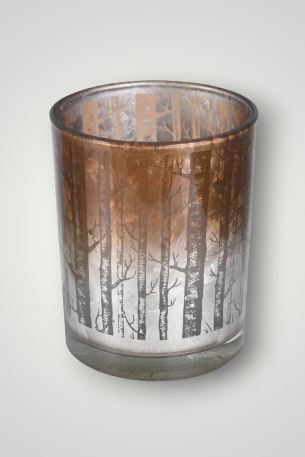 Candle holder with forest design on a white background