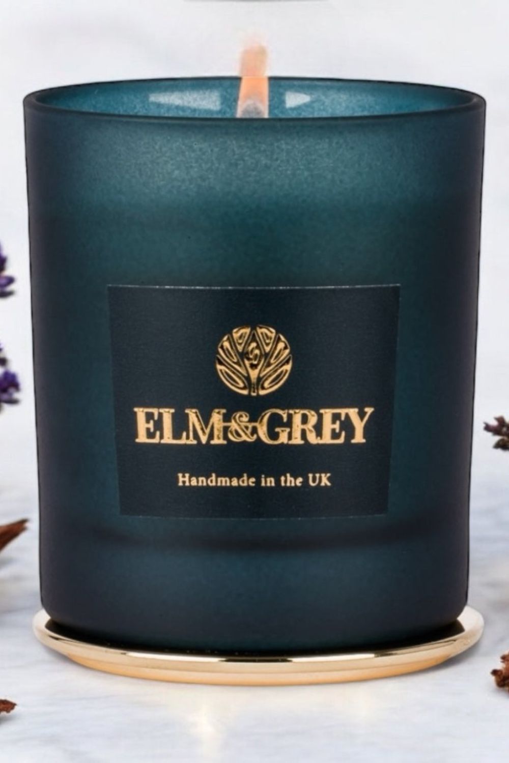 limited edition blue teal candle with 'Elm & Grey' label on a white background