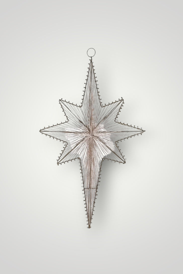 Decorative star-shaped wall hanging on a white background