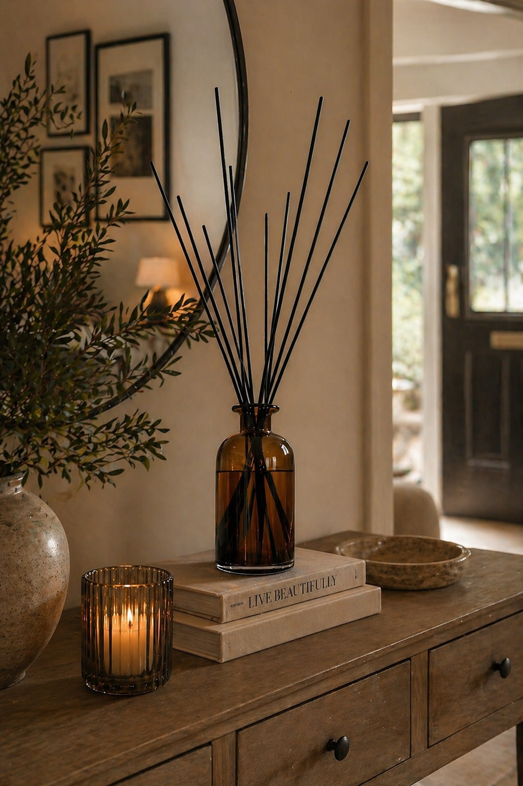 Decorative amber 1 litre reed diffuser on a hall console able