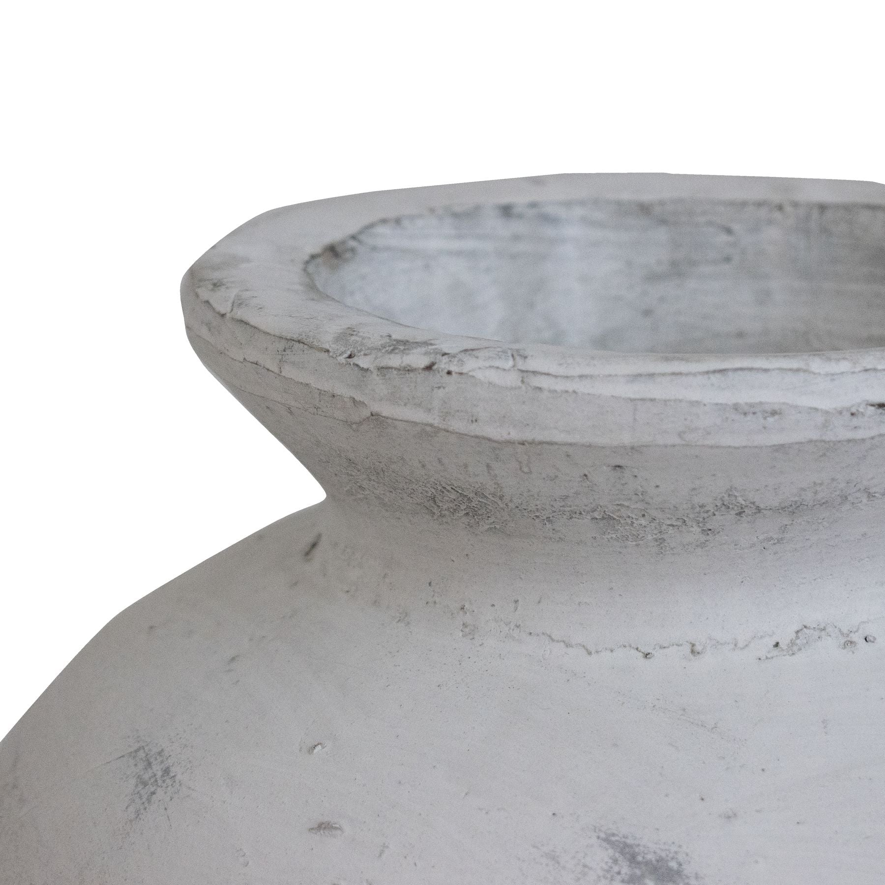 Close-up of a textured stone vase on a white background