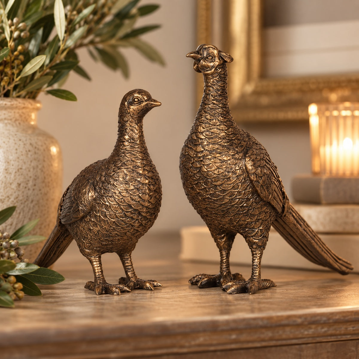 Decorative pheasant ornaments styled on a country-inspired console