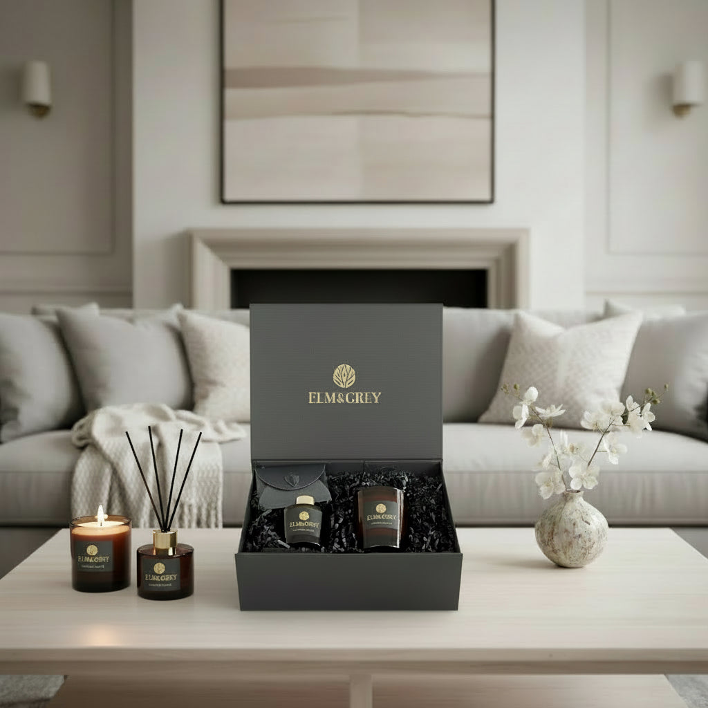 Gift box with Elm & Grey branding on a coffee table in a living room setting.