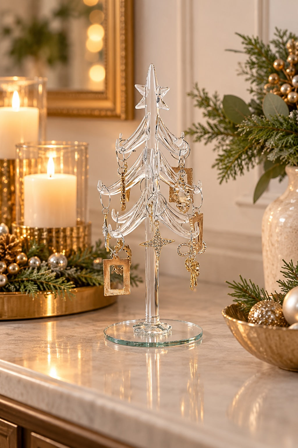 Glass Christmas tree styled with candlelight and festive greenery