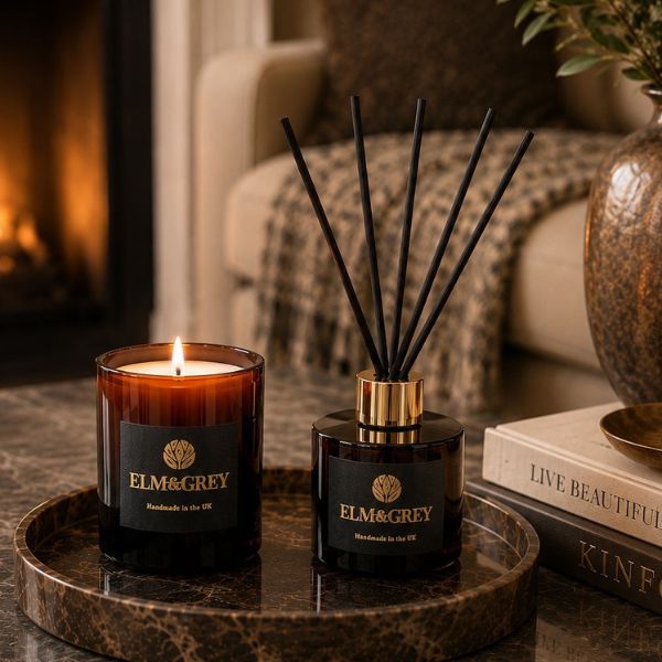 Elm & Grey Dark Honey & Tobacco candle and reed diffuser styled in a warm cosy living space