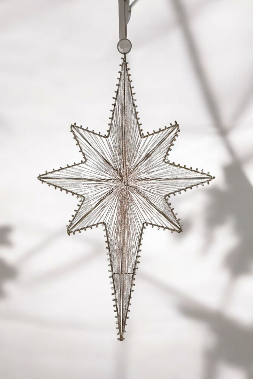 Decorative star hanging ornament on a white background