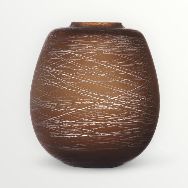 LSA brown boulder vase with intricate white line pattern on a white background