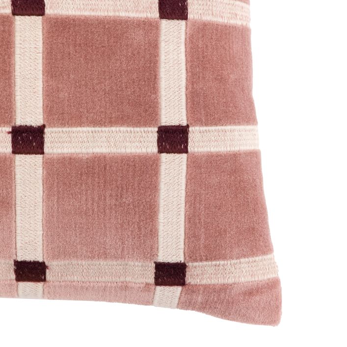 Close-up of a pink and white checkered fabric with brown accents on a white background