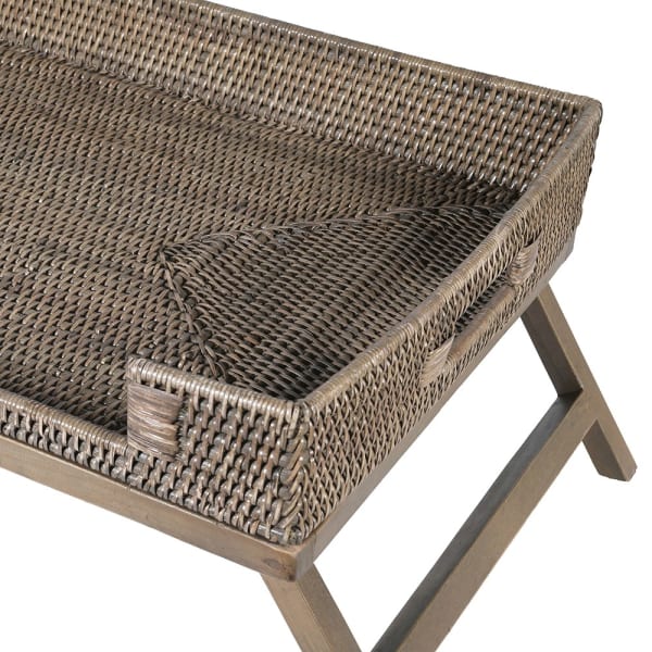 Close up of neutral rattan breakfast tray on legs