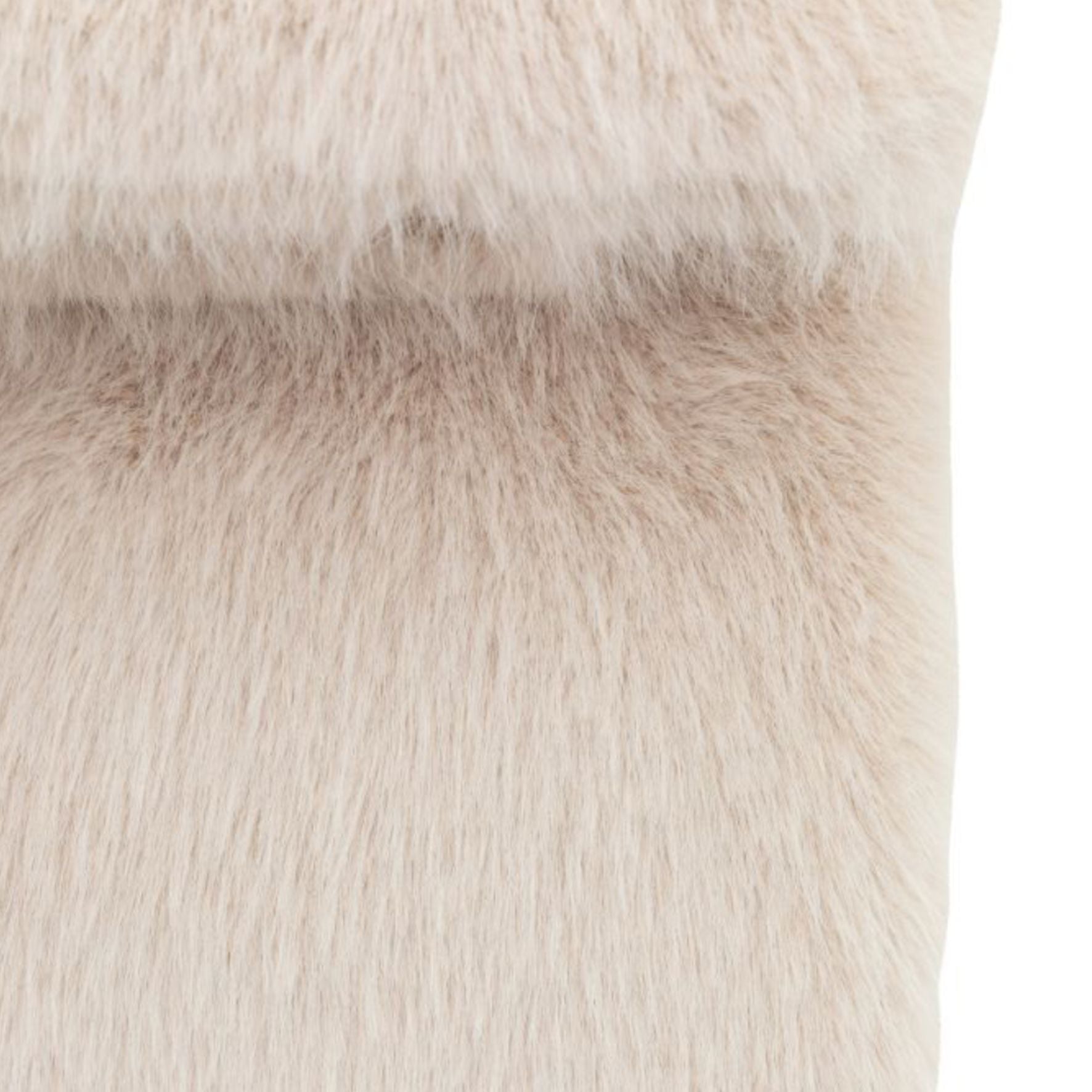 Close-up of oatmeal beige fur texture on a white background