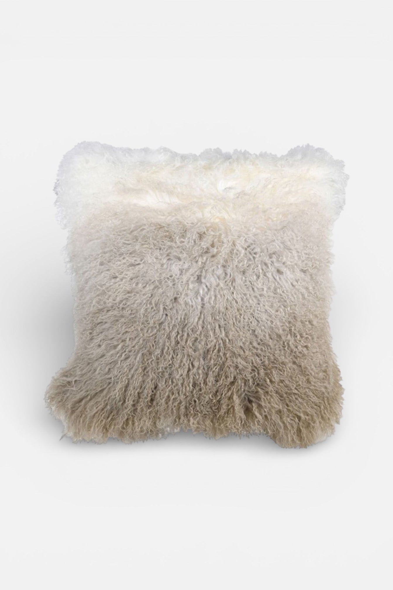 Fluffy white pillow on a light gray background