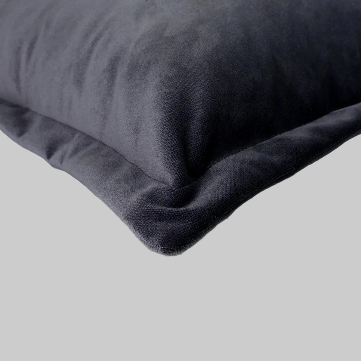 petrol blue velvet cushion with cuff close up