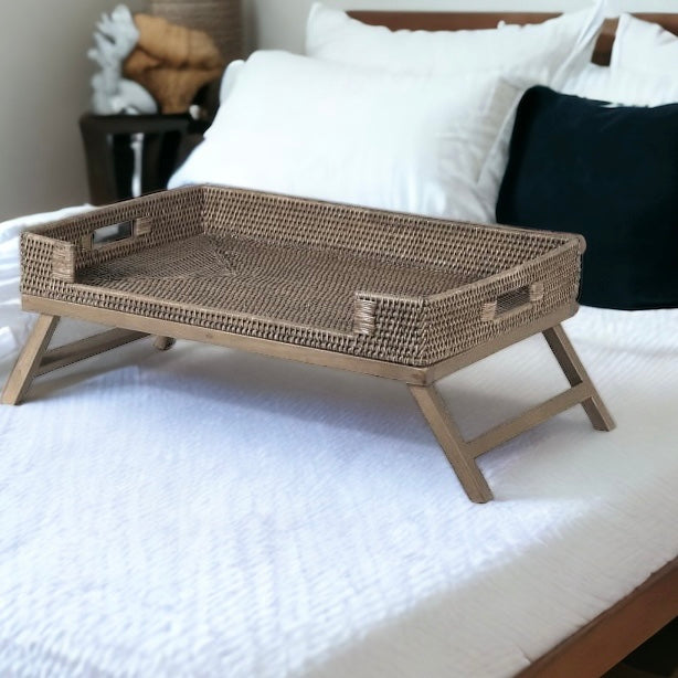 Neutral Rattan Breakfast Tray on Legs sitting on a bed