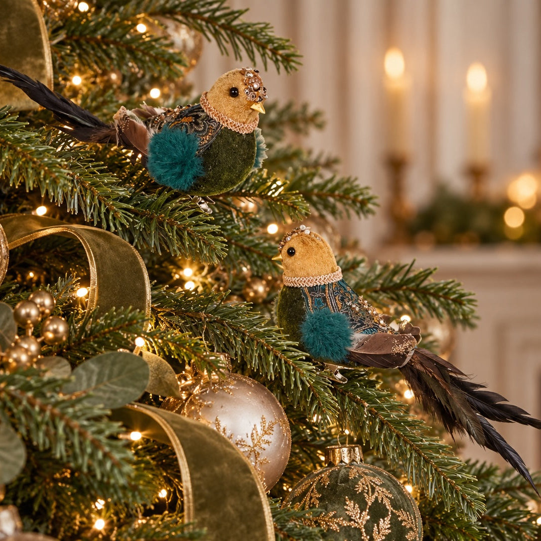 Clip bird decoration styled on a Christmas tree with warm lights