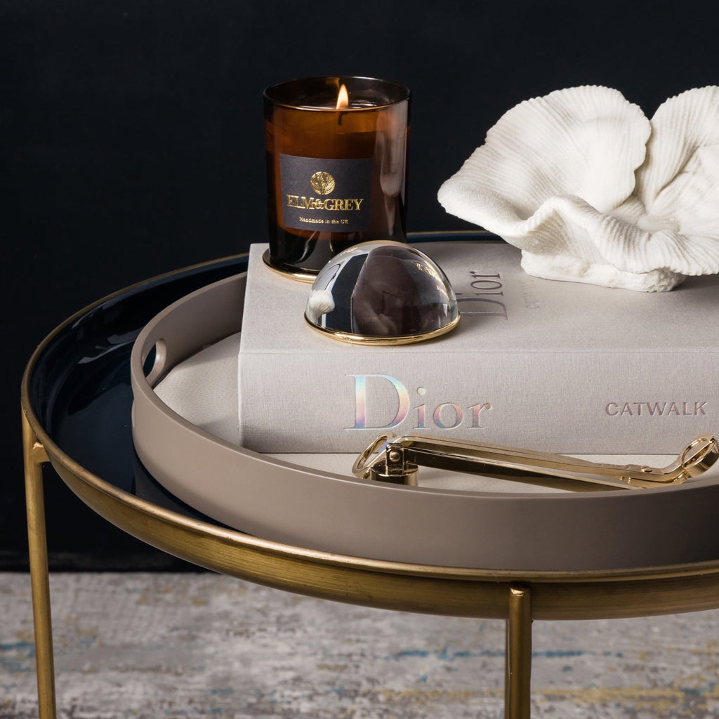 Elm and Grey Blue Enamelled tray table with curated tray including an Elm & Grey hand poured scented candle, faux coral, book and candle wick trimmers