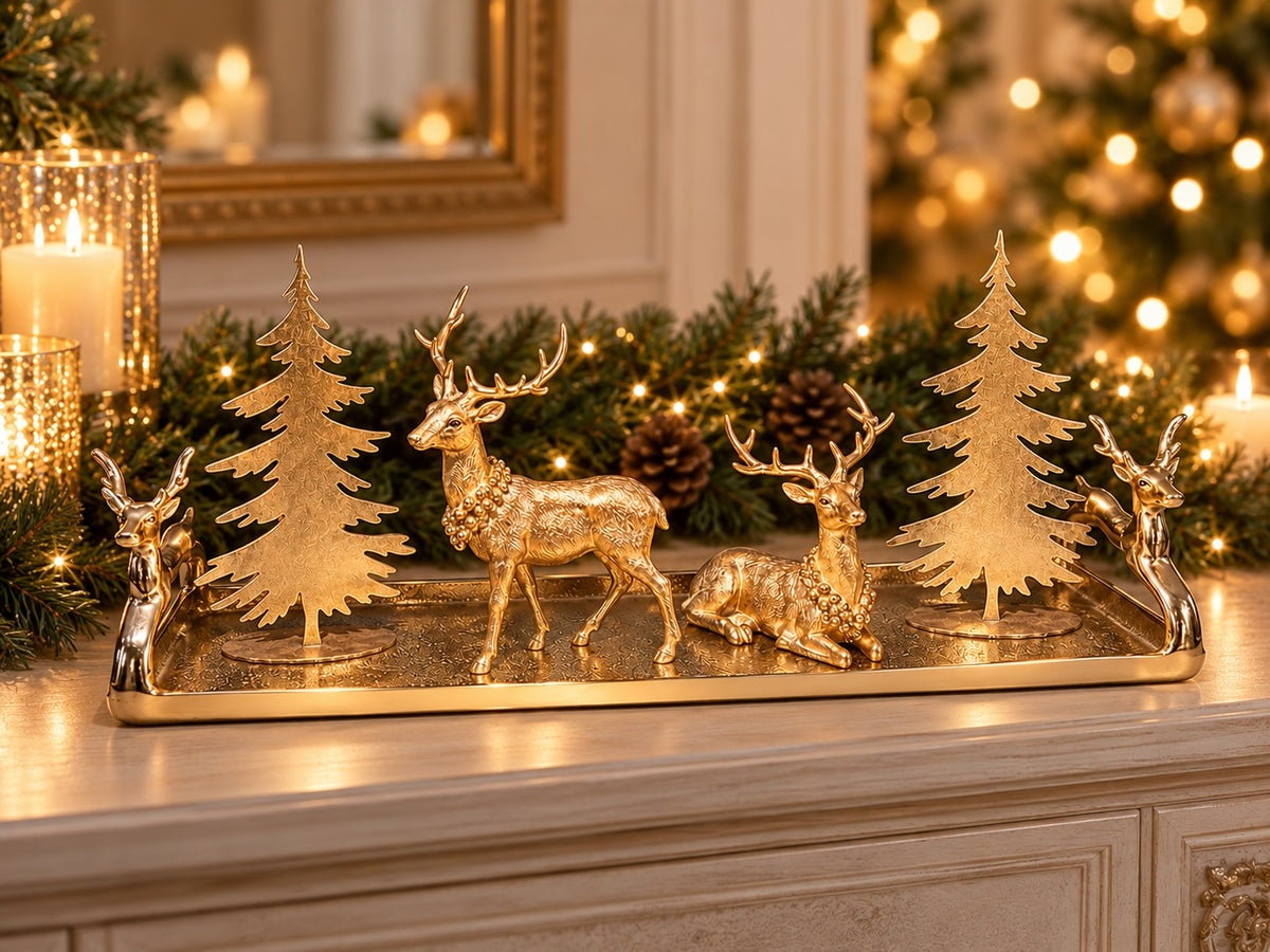 Midwinter Woodland curated Christmas display with gold reindeer and fir trees