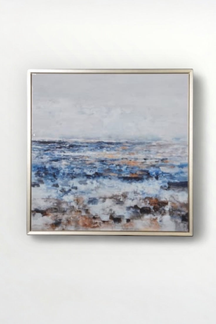 Abstract painting in a gold frame on a white wall. Elm & Grey.