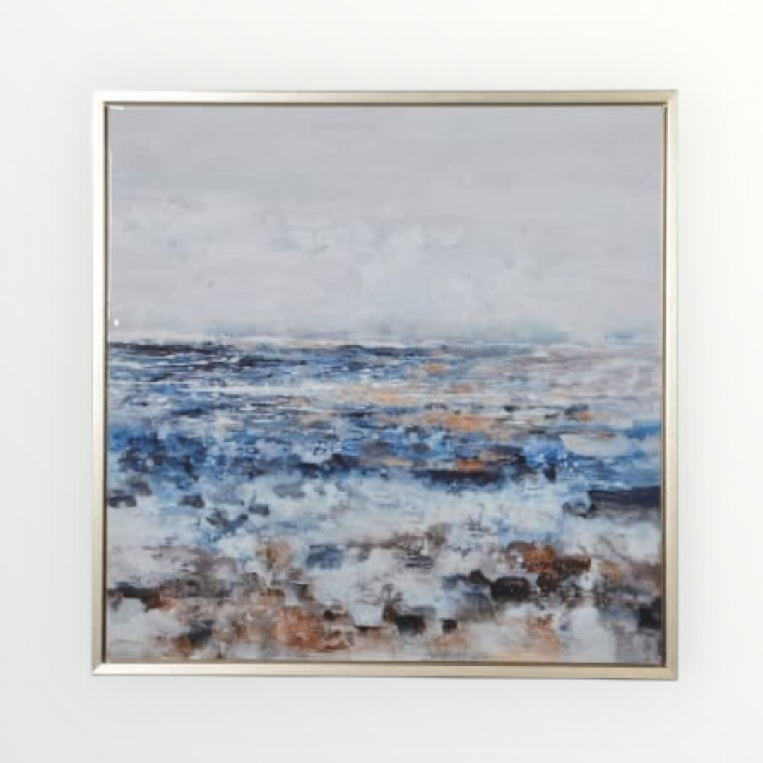 Abstract coastal canvas art with gold frame showcasing an artistic representation of a misty seaside view with brushstrokes in blue, grey, and earth tones.