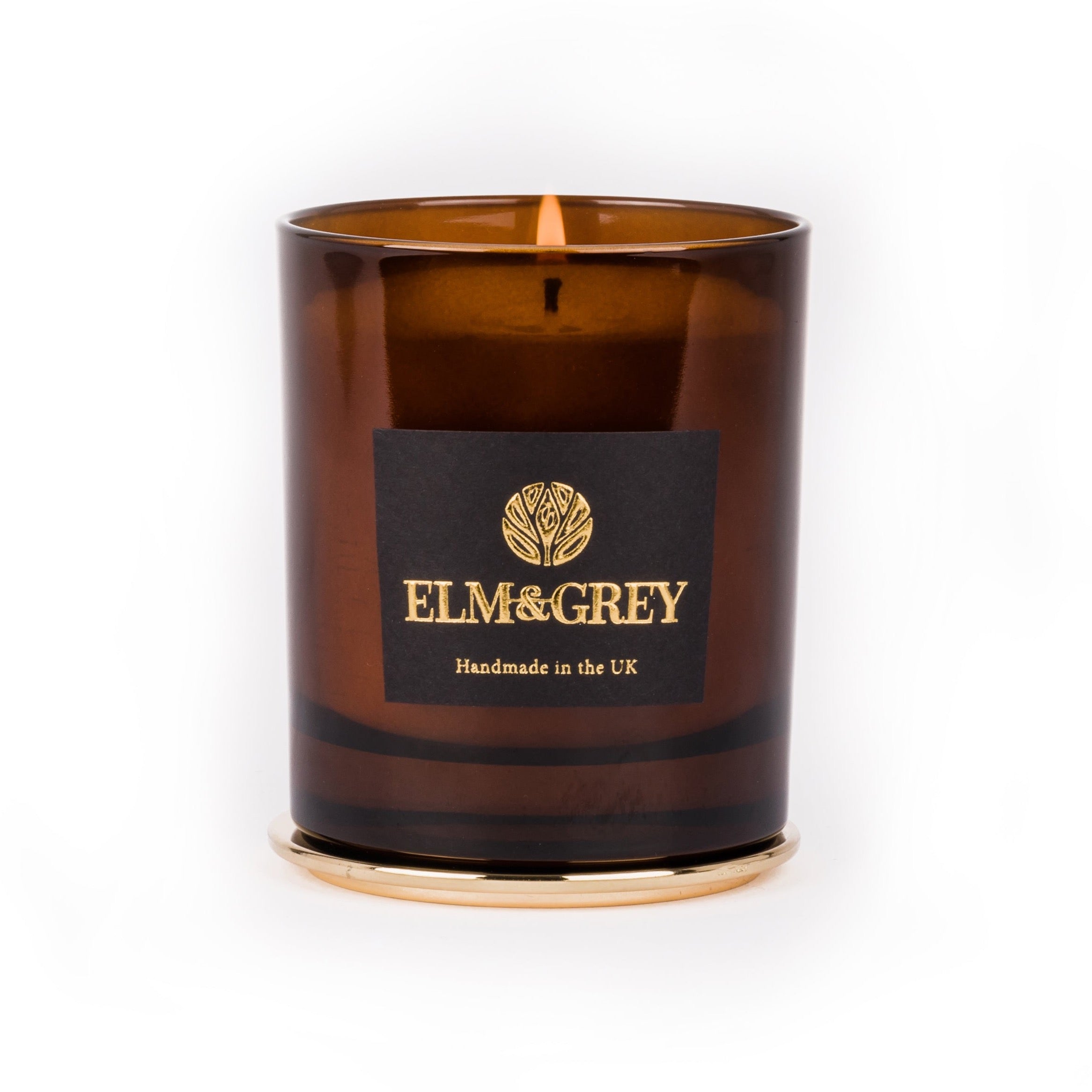 amber candle on a white background