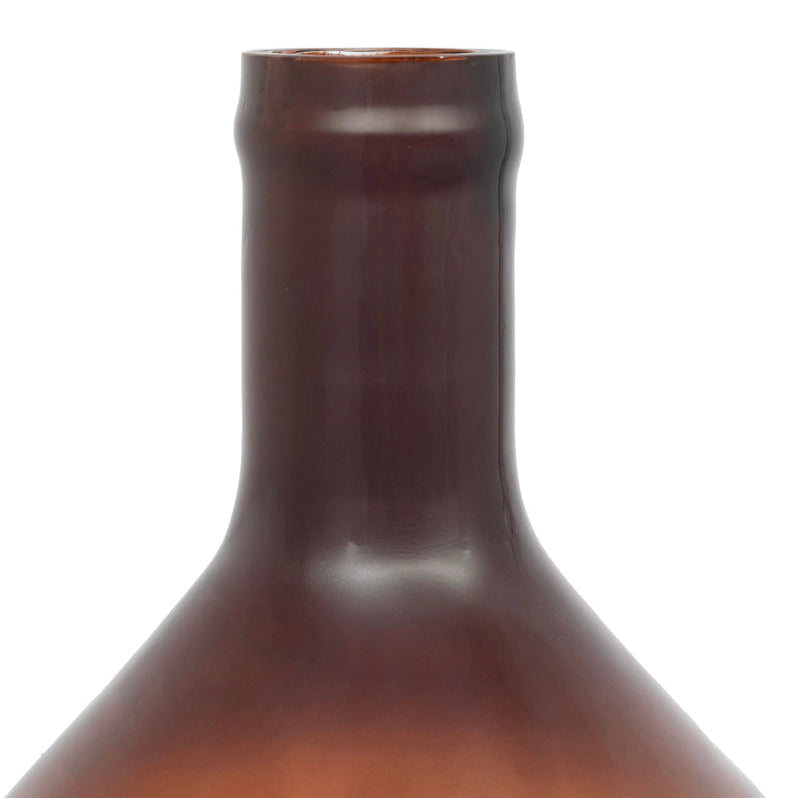 Amber glass bottle on a white background