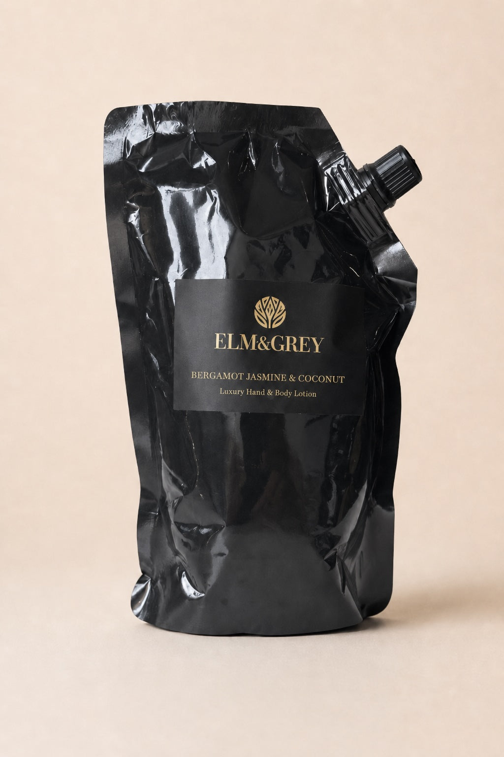 Elm & Grey Bergamot, Jasmine & Coconut hand and body lotion refill pouch on a neutral studio background