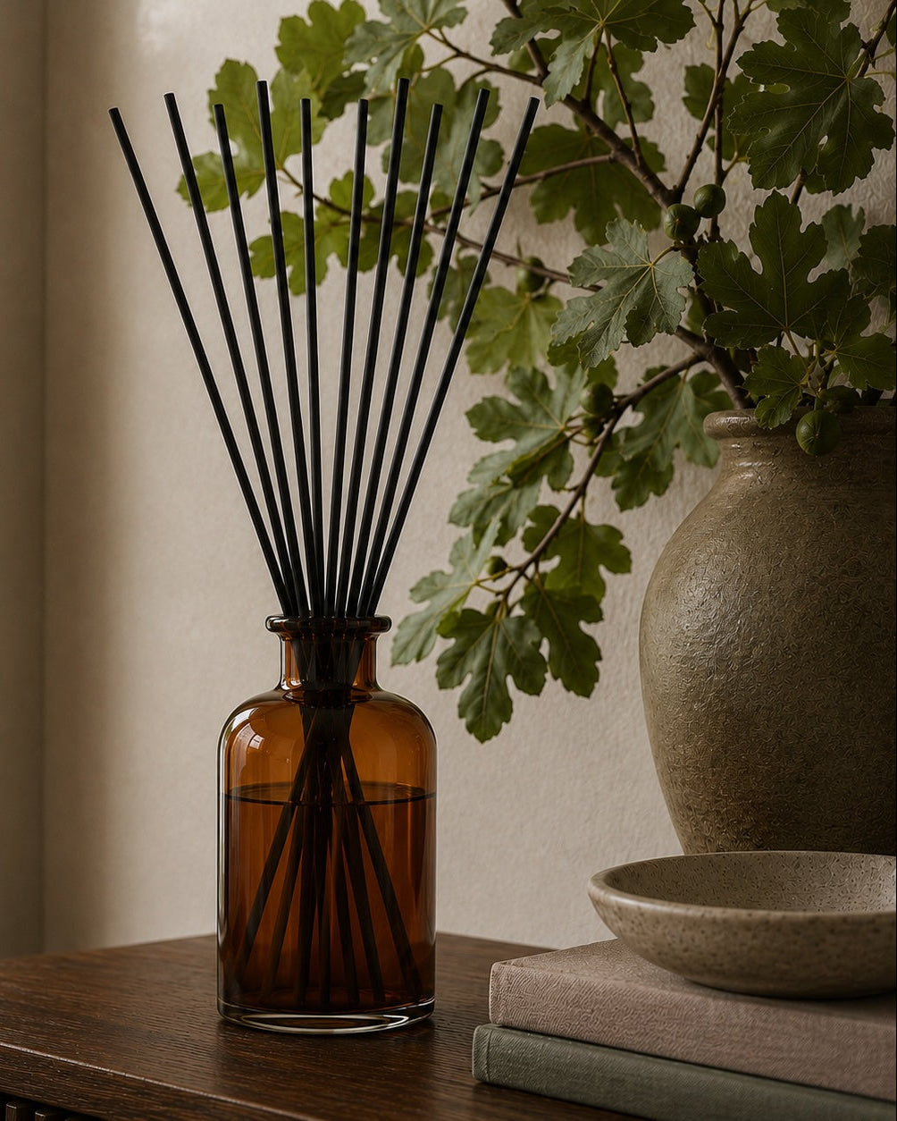 Elm & Grey Black Fig & Vetiver Statement Reed Diffuser with amber glass vessel and black reeds styled on a console table for large room home fragrance